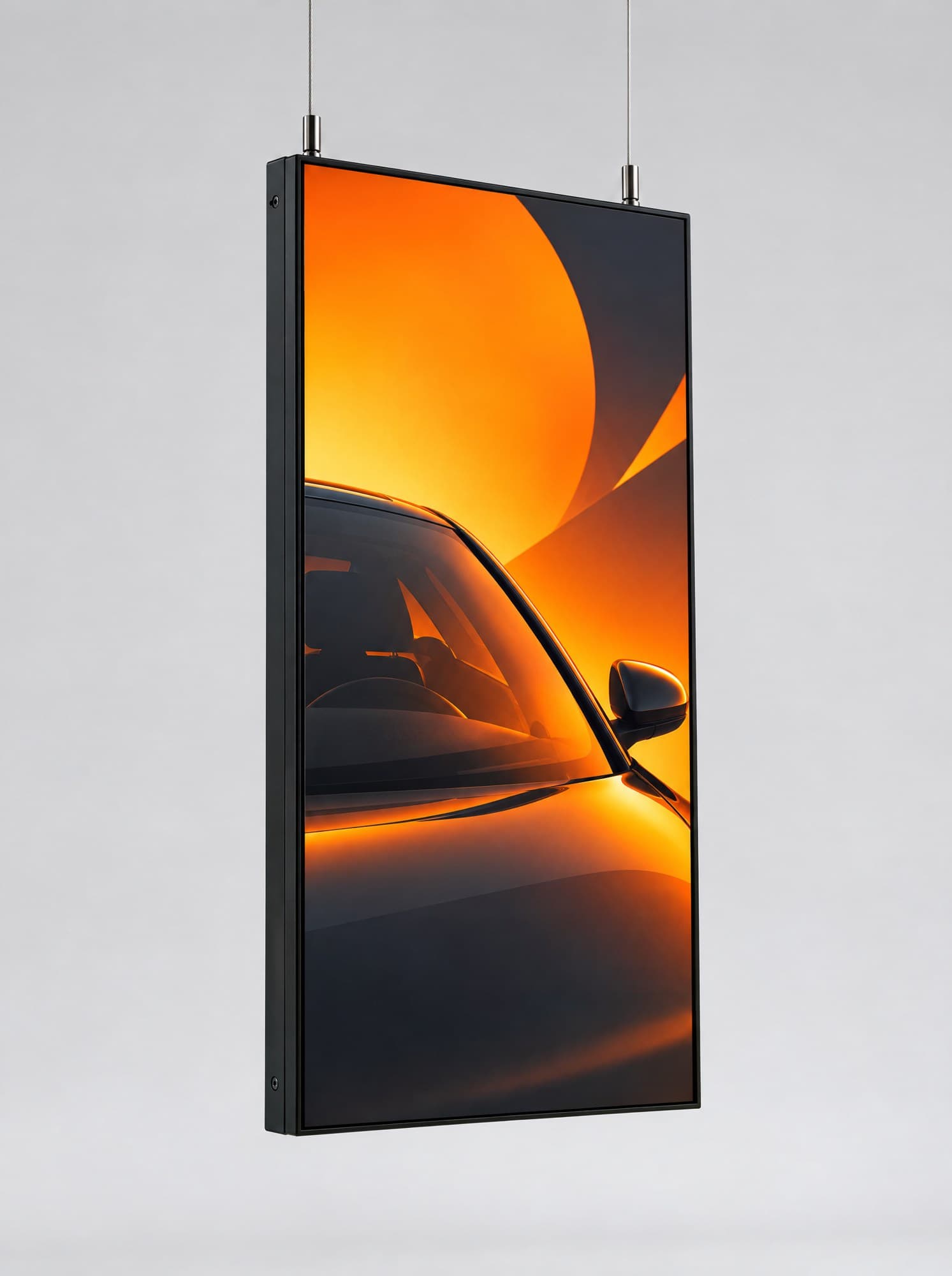 Slim portrait display suspended from two steel cables for a shop window.