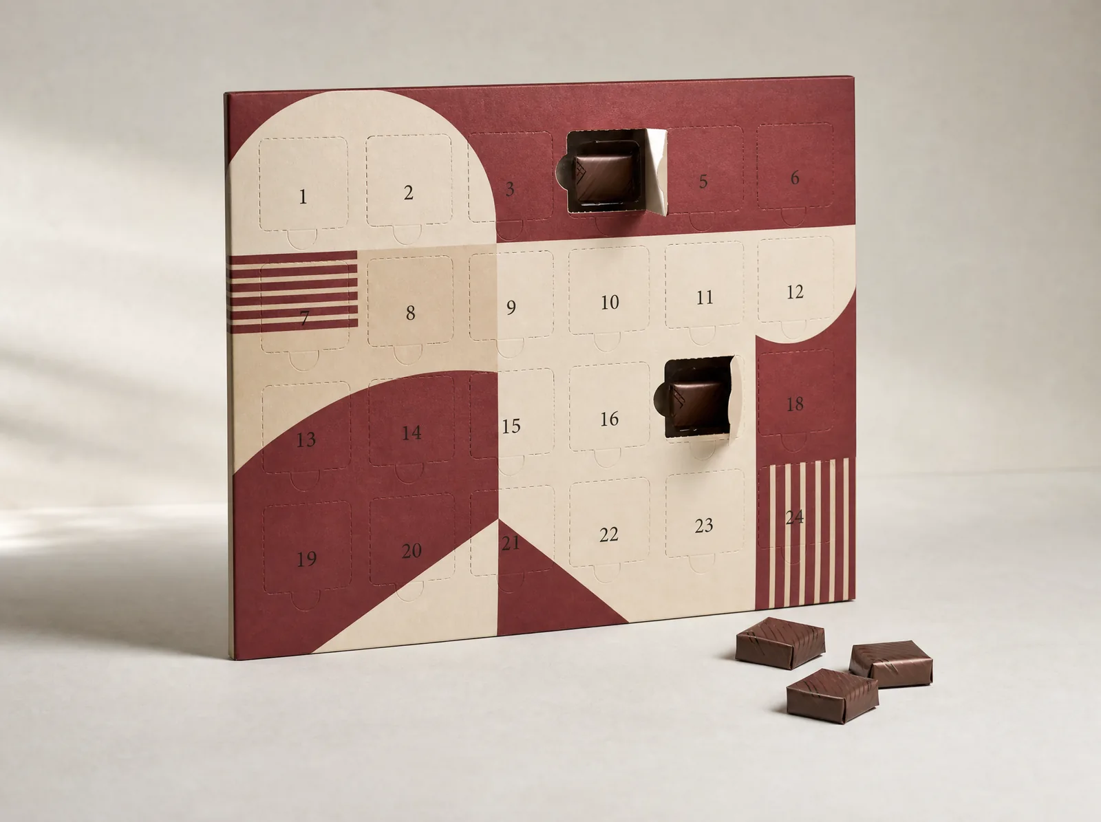 Flat red and cream chocolate advent calendar with open doors.